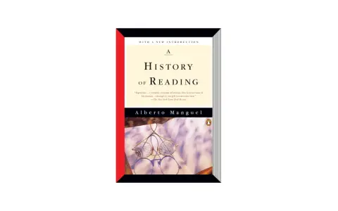 Okładka książki "A History of Reading" Alberta Manguela. Okulary leżą na otwartej księdze, symbolizując bogatą historię czytania.